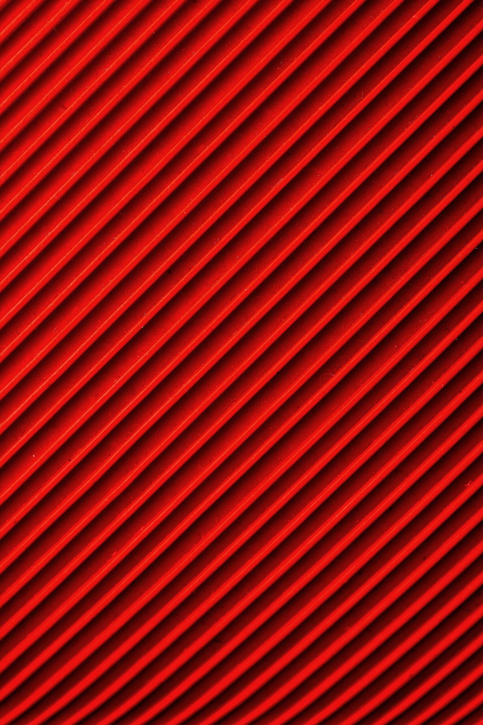 Vibrant diagonal red and black pattern, ideal for abstract backgrounds and designs.